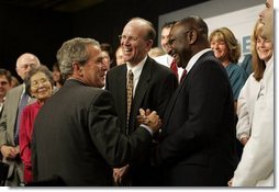 President George W. Bush greets the audience after participating in a conversation on health care and community health centers at Youngstown State University in Youngstown, Ohio, Tuesday May 25, 2004.  White House photo by Paul Morse