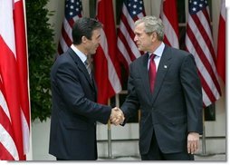 President George W. Bush and Prime Minister Anders Fogh Rasmussen of Denmark shake hands during the remarks to the press in the Rose Garden Friday, May 28, 2004. White House photo by Eric Draper.