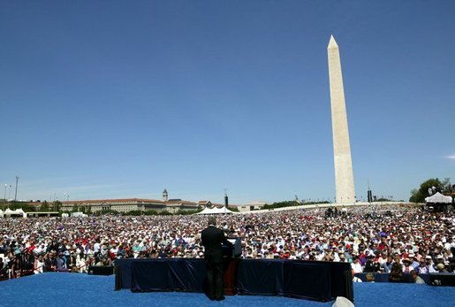 President George W. Bush delivers remarks to thousands of veterans at the National World War II Memorial on the National Mall, Saturday, May 29, 2004. White House photo by Eric Draper