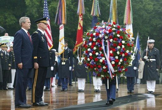 President George W. Bush stands at attention during Wreath Laying ceremonies in commemoration of Memorial Day at Arlington National Cemetery in Arlington, Virginia Monday May 31, 2004. White House photo by Joyce Naltchayan.