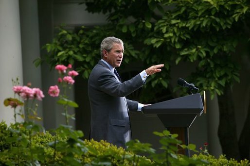 President George W. Bush welcomes the new members of Iraq's interim government during a statement in the Rose Garden Tuesday, June 1, 2004. The U.S.-led Coalition Provisional Authority will transfer sovereignty to Iraq's Interim President Sheikh Ghazi al-Yawar and Interim Prime Minister Iyad Allawi on June 30. White House photo by Eric Draper.