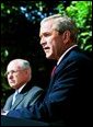 President George W. Bush participates in a joint media availability with Prime Minister of Australia John Howard in the Rose Garden Thursday, June 3, 2004.  White House photo by Joyce Naltchayan