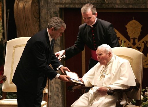 President George W. Bush presents Pope John Paul II with the Medal of Freedom at the Vatican, Friday, June 4, 2004. White House photo by Tina Hager