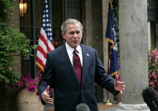 President George W. Bush speaks to the press pool outside the U.S. Ambassador's Residence in Rome, Italy, Friday, June 4, 2004. White House photo by Eric Draper