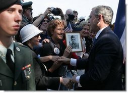 President George W. Bush meets with veterans and their families after delivering remarks during ceremonies marking the 60th anniversary of D-Day at the American Cemetery in Normandy, France, June 6, 2004.  White House photo by Paul Morse