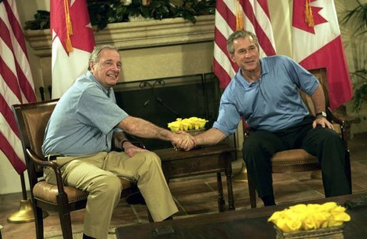President George W. Bush and Canadian Prime Minister Paul Martin shake hands during their bilateral talks at the G-8 Summit in Sea Island, Ga., Tuesday, June 8, 2004. White House photo by Eric Draper