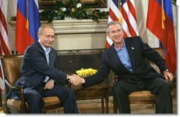 President George W. Bush shakes hands with Russian President Vladimir Putin during their bilateral meeting at the G-8 Summit in Sea Island, Ga., Tuesday, June 8, 2004.  White House photo by Eric Draper