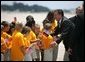 German Chancellor Gerhard Schroeder greets students upon his arrival for the G8 summit at Hunter Army Airfield in Savannah, Ga., June 8, 2004. White House photo by Paul Morse