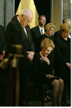 Vice President Dick Cheney, Nancy Reagan and other mourners bow their heads during the State Funeral Ceremony in the Rotunda of the U.S. Capitol Wednesday, June 9, 2004.  White House photo by David Bohrer