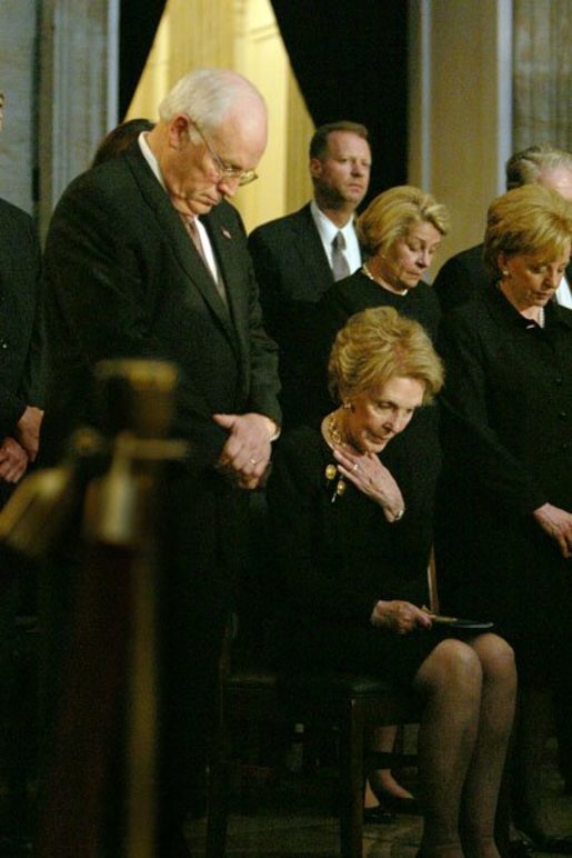 Vice President Dick Cheney, Nancy Reagan and other mourners bow their heads during the State Funeral Ceremony in the Rotunda of the U.S. Capitol Wednesday, June 9, 2004. White House photo by David Bohrer.