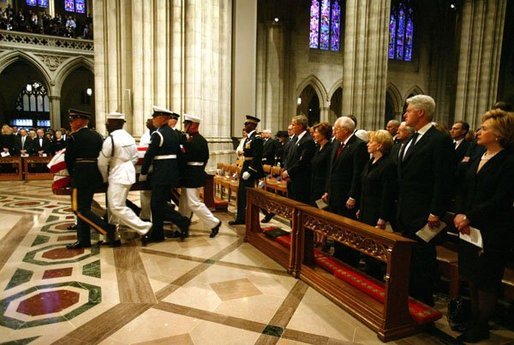President George W. Bush and Laura Bush, Vice President Dick Cheney and Lynne Cheney, along with four former US Presidents, and other world dignitaries watch as the casket of former President Ronald Reagan is carried into the National Cathedral in Washington, D.C., Friday, June 11, 2004. White House photo by David Bohrer.