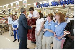 President George W. Bush greets shoppers at the Hy-Vee grocery and pharmacy store in Liberty, Mo., June 14, 2004.  White House photo by Paul Morse