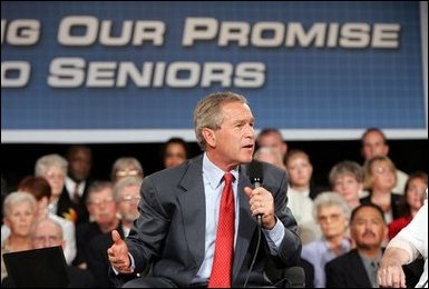 President George W. Bush makes a point during a conversation on Medicare-approved prescription drug discount cards in Liberty, Mo., June 14, 2004.