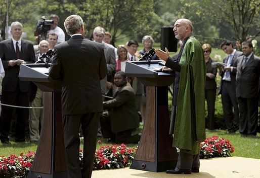 President George W. Bush and Hamid Karzai of Afghanistan hold a joint press conference in the Rose Garden Tuesday, June 15, 2004. White House photo by Paul Morse.