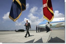  President George W. Bush walks past a military honor guard after arriving aboard Air Force One at MacDill Air Force Base in Tampa, Florida, Wednesday, June 16, 2004.  White House photo by Eric Draper