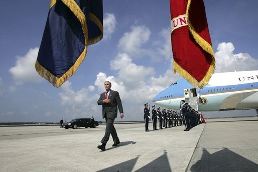  President George W. Bush walks past a military honor guard after arriving aboard Air Force One at MacDill Air Force Base in Tampa, Florida, Wednesday, June 16, 2004. White House photo by Eric Draper.