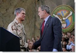 President George W. Bush greets Lieutenant General Lance Smith, Commander Central Command, before delivering remarks to military personnel at MacDill Air Force Base in Tampa, Florida, Wednesday, June 16, 2004.   White House photo by Eric Draper