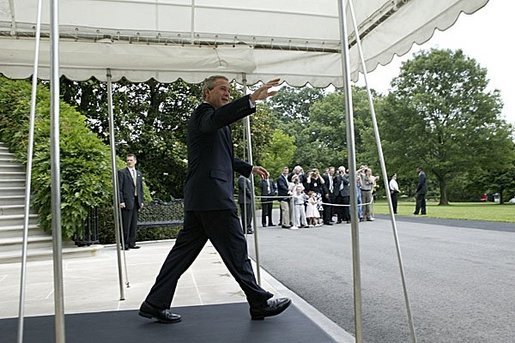 President George W. Bush waves as he departs from the White House South Lawn aboard Marine One Monday, June 21, 2004. White House photo by Tina Hager.