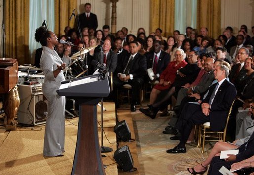 Dione Taylor sings with the Billy Taylor Trio as part of a reception for Black Music Month held in the East Room of the White House on June 22, 2004. White House photo by Paul Morse