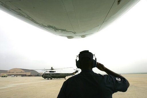 Marine One arrives in front of Air Force One and crew as the President George W. Bush and Mrs.Laura Bush depart Andrews Air Force Base en route to Shannon, Ireland, Friday, June 25, 2004. White House photo by Eric Draper.