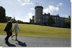 Laura Bush and Ireland’s Deputy Chief of Protocol Joe Brennan walk along the grounds of Dromoland Castle during a day of meetings between the United States and European Union in Shannon, Ireland, Saturday, June 26, 2004.  White House photo by Joyce Naltchayan
