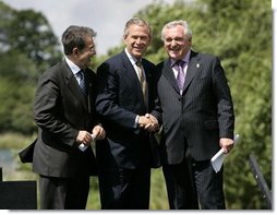 President George W. Bush joins Prime Minister of Ireland Bertie Ahern, right, and President of the European Commission Romano Prodi following their press conference at the Dromoland Castle in Shannon, Ireland, Saturday, June 26, 2004.  White House photo by Eric Draper