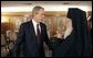 President George W. Bush talks with Ecumenical Patriarch Bartholomew I after meeting with religious leaders in Istanbul, Turkey, Sunday, June 27, 2004.  White House photo by Eric Draper