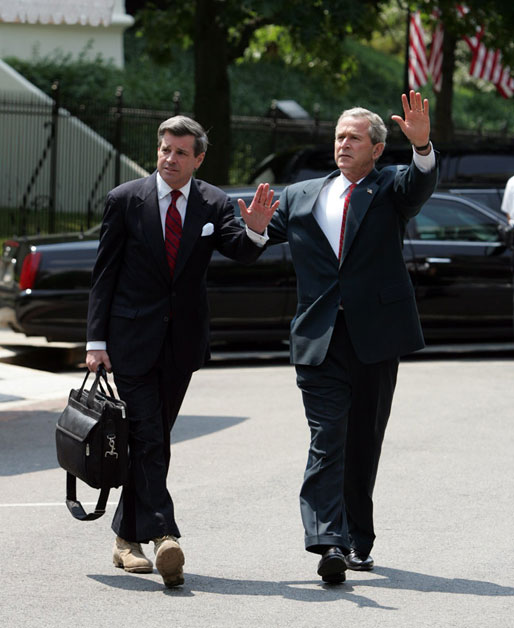 President George W. Bush and Ambassador Paul Bremer walk across West Executive drive outside the West Wing of the White House on June 30, 2004. White House photo by Paul Morse.