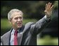 President George W. Bush waves as he departs the South Lawn for Camp David, Friday, July 2, 2004. White House photo by Eric Draper