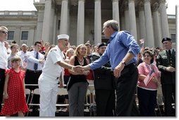 President George W. Bush greets the crowd at the Fourth of July Celebration on the steps of the Capitol in Charleston, West Virginia on Independence day, 2004.  White House photo by Tina Hager