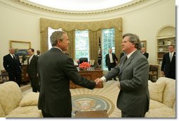President George W. Bush meets with the Prime Minister David Oddsson of Iceland in the Oval Office Tuesday, July 6, 2004.  White House photo by Eric Draper