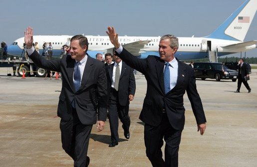 President George W. Bush arrives in Raleigh, North Carolina with Congressman Richard Burr on Wednesday July 7, 2004. The President was in North Carolina to meet with pending North Carolina judicial nominees. White House photo by Paul Morse