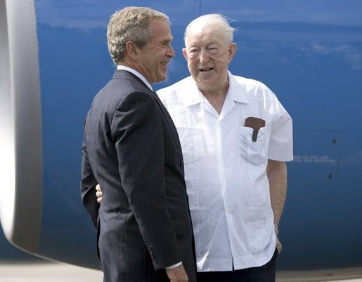 President George W. Bush chats with Freedom Corps greeter Scotty Maconochie after landing in Waterford, Michigan on Wednesday July 7, 2004. White House photo by Paul Morse