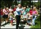President George W. Bush stops by a lemonade stand along his motorcade route in Raleigh, North Carolina on July 7, 2004. White House photo by Paul Morse.