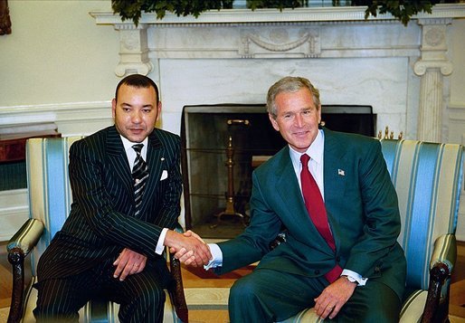 President George W. Bush talks with His Majesty King Mohammed VI of Morocco in the Oval Office Thursday, July 8, 2004. White House photo by Eric Draper.
