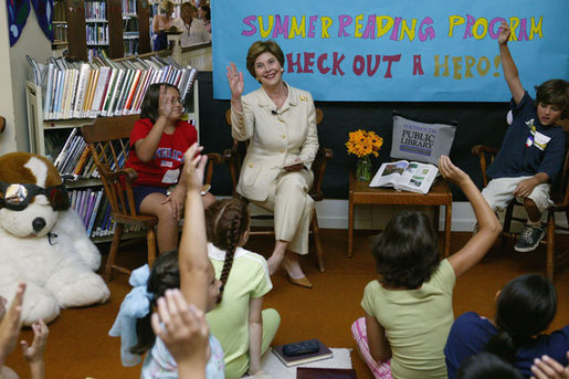 Laura Bush discusses the importance of reading with children participating in the No Child Left Behind Summer Reading Program at the Portsmouth Public Library in Portsmouth, New Hampshire, Friday, July 9, 2004. White House photo by Joyce Naltchayan