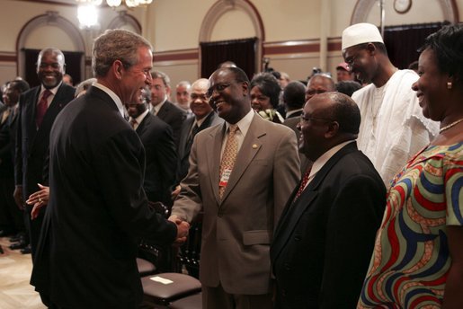 After signing into law the African Growth and Opportunity Act (AGOA) Acceleration Act of 2004, President George W. Bush meets with ceremony attendees in the Dwight D. Eisenhower Executive Office Building Tuesday, July 13, 2004. White House photo by Paul Morse