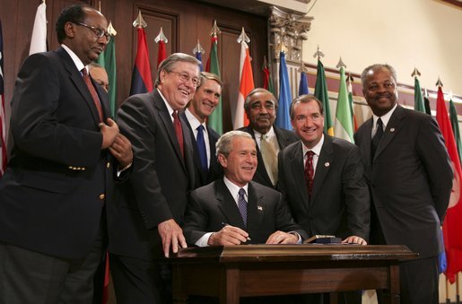 President George W. Bush signs into law the African Growth and Opportunity Act (AGOA) Acceleration Act of 2004 in the Dwight D. Eisenhower Executive Office Building Tuesday, July 13, 2004. White House photo by Paul Morse