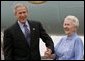 President George W. Bush meets USA Freedom Corps Greeter Grace McCarthy, 83, upon his arrival in Marquette, Mich., Tuesday, July 13, 2004. Ms. McCarthy has volunteered more than 4,000 hours with local groups, including the Retired and Senior Volunteer Program in Marquette. White House photo by Eric Draper