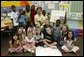 Laura Bush poses for a photo with students during a visit to Hueytown Elementary School in Birmingham, Alab., Wednesday, July 14, 2004. White House photo by Joyce Naltchayan
