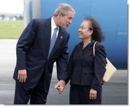 President George W. Bush chats with Freedom Corps greeter Lam Pham after arriving at Tampa International Airport in Tampa, Florida on Friday July 16, 2004.  White House photo by Paul Morse