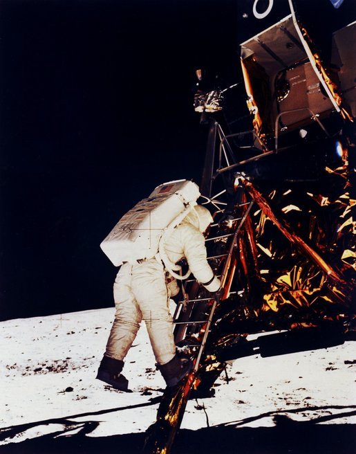 Buzz Aldrin climbs down the Eagle's ladder to the surface. Click for larger image. Photo credit: NASA.