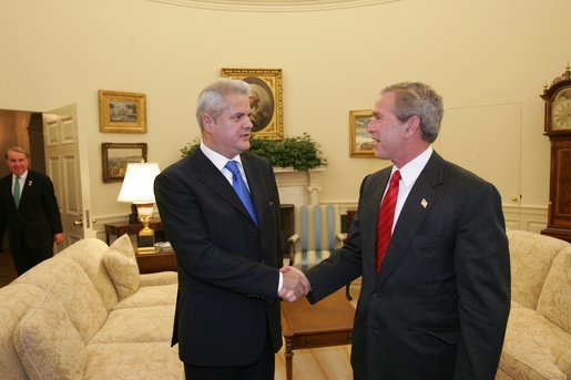 President George W. Bush meets with Prime Minister Adrian Nastase of Romania in the Oval Office Wednesday, July 21, 2004 White House photo by Eric Draper.