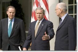 Accompanied by Chairman Thomas Kean, left, and Vice Chairman Lee Hamilton of the 911 Commission, President George W. Bush addresses the press during the presentation of the Commission's report in the Rose Garden Thursday, July 22, 2004.   White House photo by Eric Draper