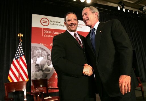 President George W. Bush greets Marc Morial, President of the National Urban League, after delivering his remarks in Detroit, Mich., Friday, July 23, 2004. White House photo by Eric Draper