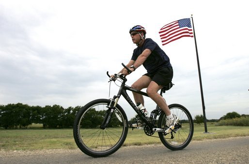 President George W. Bush rides his mountain bike on his ranch in Crawford, Texas, Monday, July 26, 2004. White House photo by Eric Draper.