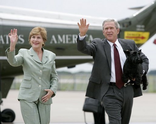 President George W. Bush and Mrs. Bush wave as they walk to Air Force One with Barney before departing Waco, Texas, Thursday, July 29, 2004. White House photo by Eric Draper.