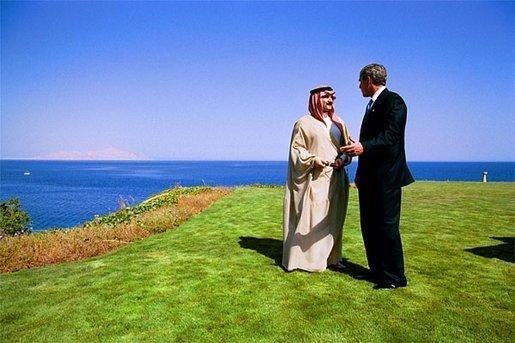President George W. Bush talks with the King Hamad Bin Issa Al Khalifa of Bahrain near the shore of the Red Sea in Egypt June 3, 2003. File Photo. White House photo by Eric Draper.