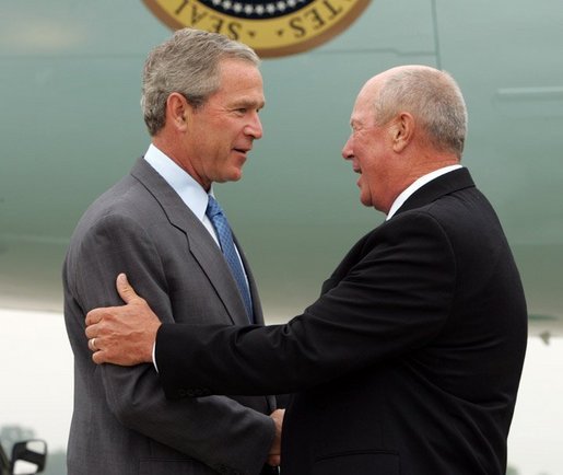 President George W. Bush chats with Freedom Corps greeter Charlie Graas after touching down in Springfield, Missouri on Friday July 30, 2004. White House photo by Paul Morse.