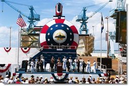 Laura Bush christens the U.S.S. Texas, a Virginia class submarine, in Newport News, Va., July 31, 2004. "Today, we celebrate the devoted service of the men and women of the United States Navy and the skill of America's shipbuilders. I'm honored to christen the triumph that is the Texas," said Mrs. Bush in her remarks.   White House photo by Joyce Naltchayan